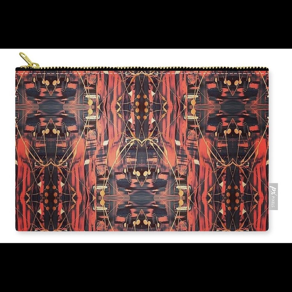 Hand painted textiles put onto zipper pouches